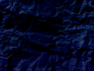 Abstract seamless grunge dark blue Crumpled Paper or wrinkled paper Pattern, Realistic and crumpled blue paper texture or blue canvas or a blue paper surface.