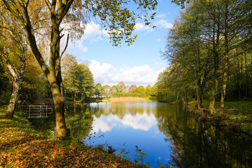 Obraz premium Ostheim natural bathing lake near Malsfeld. Idyllic landscape by the lake in autumn. 