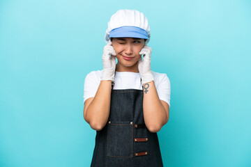 Fishwife Argentinian woman isolated on blue background frustrated and covering ears
