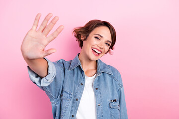 Closeup photo of young adorable woman laughing positive friendly girl waving palm five symbol count number welcome isolated on pink color background