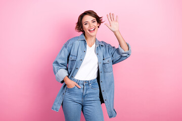Photo of youth friendly cheerful positive showing five palm hello symbol wearing denim jeans shirt...
