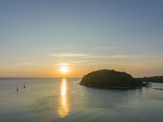 .aerial view beautiful sunset above Kala island at Layan beach Phuket..colorful sky of sunset at horizon.Phuket beach sea Amazing beach, .Beautiful beach Phuket Thailand, Nature and travel concept.