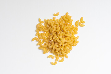 Homemade pasta on white isolated background in macro top view.
