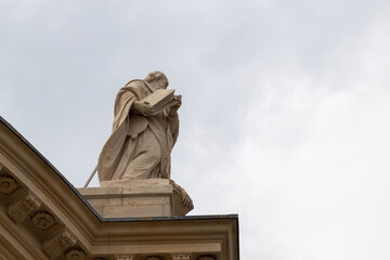 sculpture on the roof of a church