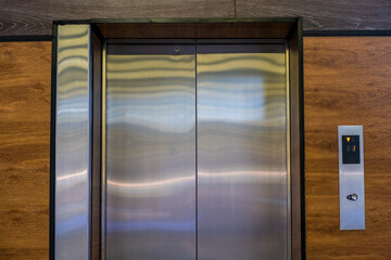Photo of a classic metal-colored elevator © ffrinat