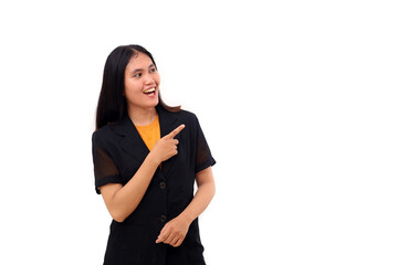 Excited young asian business woman standing while pointing at blank space beside her. Isolated