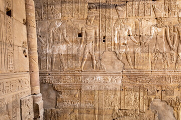 Edfu Horus Temple Walls Decorated with Reliefs of Ancient Egyptian Gods. Ptolemaic Temple of Horus,...