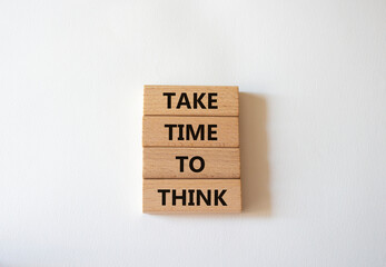 Take time to think symbol. Wooden blocks with words Take time to think. Beautiful white background. Business and Take time to think concept. Copy space.