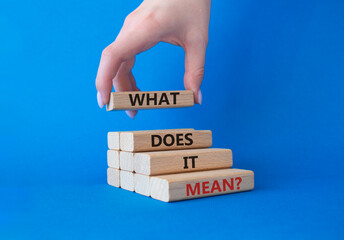 What does it mean symbol. Wooden blocks with words What does it mean. Businessman hand. Beautiful...