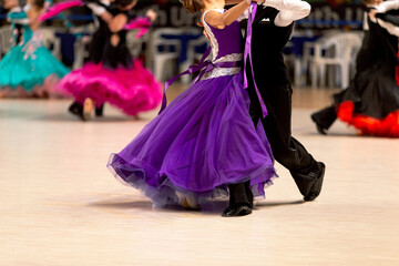 young couple dancers dancing waltz in competition