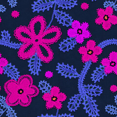 Seamless background with embroidery. Fabric with vivid abstract flowers.