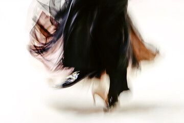abstract image dancing couple in blurry motion on white background