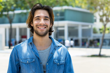 Handsome mexican young adult man with beard