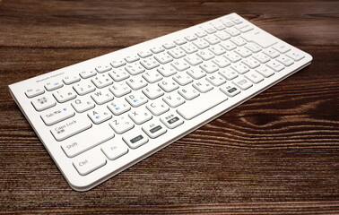 White bluetooth keyboard (diagonal placement)