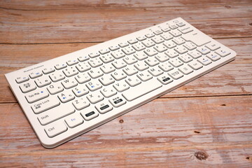 White bluetooth keyboard (diagonal placement)