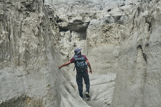 Man walking in rocky canyon