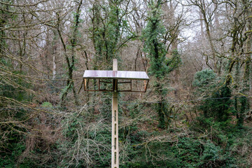 Stationary small solar battery on a concrete pole.