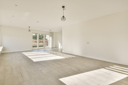 Spacious empty room on sunny day