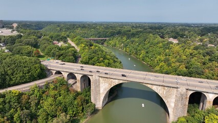 Beautiful stone bridge with arches over river Veterans Memorial Bridge in Rochester New York 
