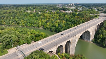 Beautiful stone bridge with arches over river Veterans Memorial Bridge in Rochester New York 