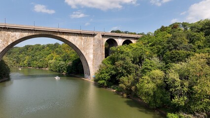 Beautiful stone bridge with arches over river Veterans Memorial Bridge in Rochester New York 
