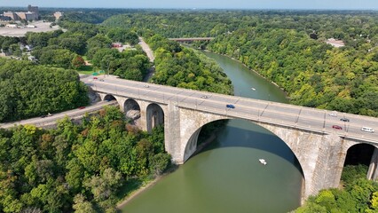 Beautiful stone bridge with arches over river Veterans Memorial Bridge in Rochester New York 