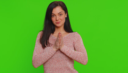 Please, God, forgive me. Young woman sincerely praying to God and looking up with pleading...