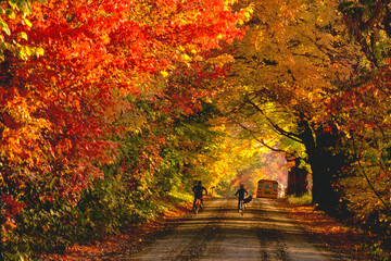 Two boys race the school bus to school in Jericho, Vermont.