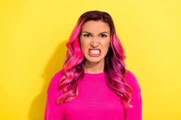 Portrait of grumpy millennial lady feel offense have conflict show teeth bright haircut isolated on yellow color background - obrazy, fototapety, plakaty