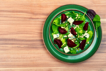Salad with beet, blue cheese and pine nuts