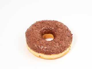 Chocolate donut with chocolate chips on a white background. close-up.