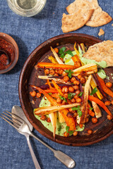 Vegetarian chickpea salad, overhead, with wine