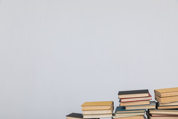 science knowledge reading many books in stacks in a library on a white background
