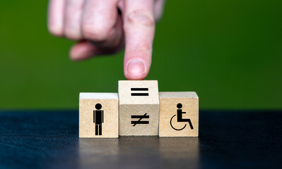 Symbol for equal rights of persons with disabilities. Hand turns wooden cube and changes the...