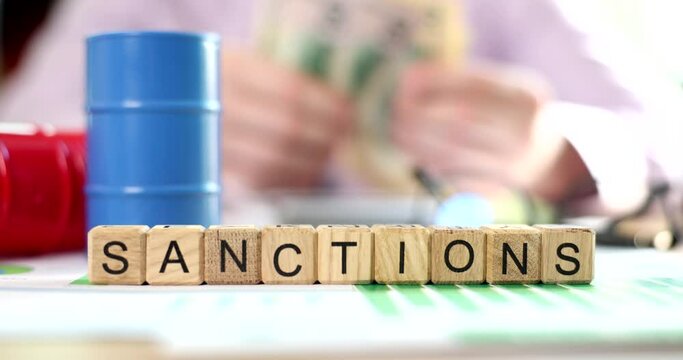 Sanctions inscription on wooden cubes on the table