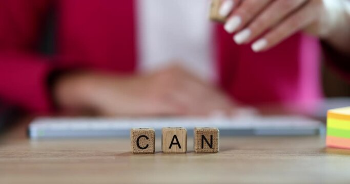Can't and can on wooden cubes in the office, closeup