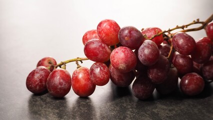 bunch of grapes laying on the table 