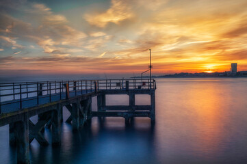 Fototapeta premium A long exposure of Victoria pier situated at the entrance to Portsmouth harbour in Hampshire, UK. Now mainly used for fishing.