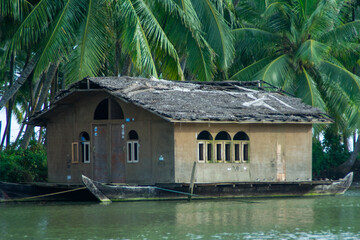 Boathouse floating in the jungle waters in Kerala