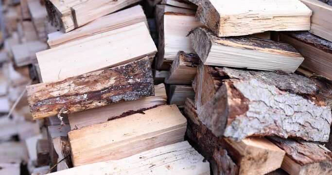 Firewood is neatly folded on each other, close-up