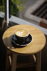 barista making a cup of latte art