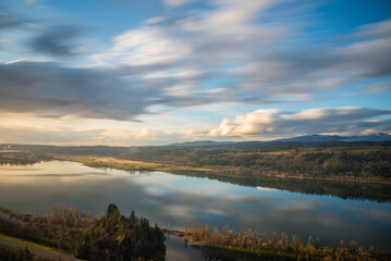 Naklejka na ściany i meble Golden hour landscape views over Rooster Rock State Park and the beautiful Columbia River Gorge, Oregon