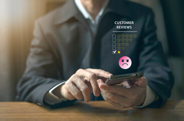 Unhappy Client hand using desktop and give one star symbol for  dissatisfied of product and service concept, bad review,bad  service ,bad quality,low rating.