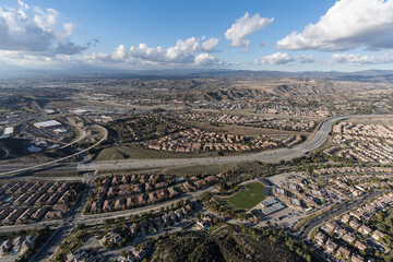 Aerial cityscape view of suburban sprawl north of Los Angeles in Santa Clarita, California.
