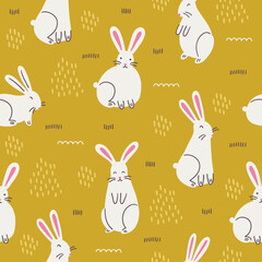 Easter seamless pattern with rabbits and grass on yellow background