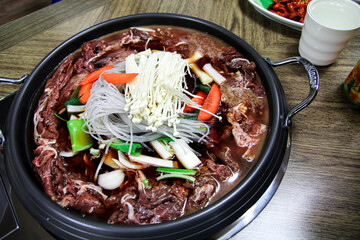 Korean hot food. Spicy Korean soup with beef, green onions, bean sprouts, mushrooms. Popular Korean hot dishes.