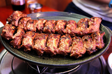 Korean barbecued pork ribs. Meat roasted on the grill.