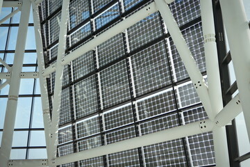 facade of solar panels seen from inside the modern building