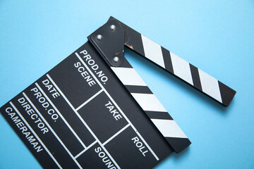 Movie clapper on the blue background.