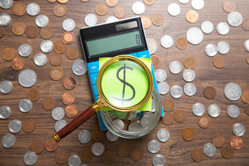 Dollar symbol on the sticky note with a calculator and coins. Business. Finance